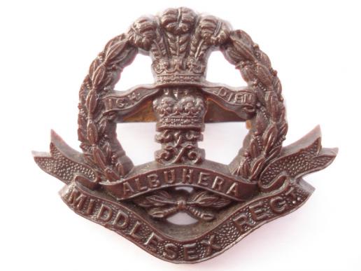 WW2 War Economy Plastic Middlesex Regt Cap Badge